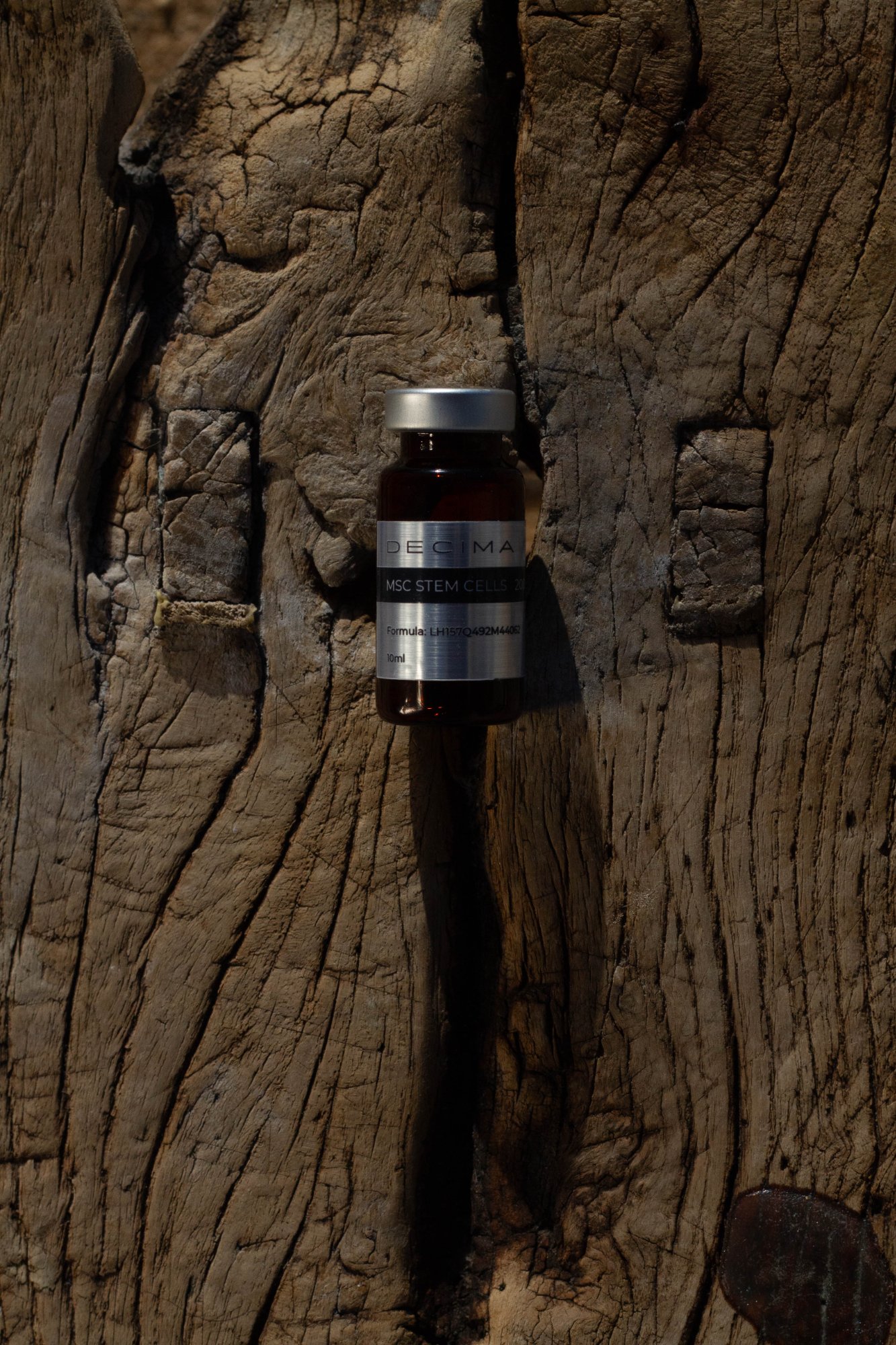 Decima vial on ancient wood